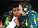 Karun Chandhok talks to his engineer following a very brief outing in his Lotus