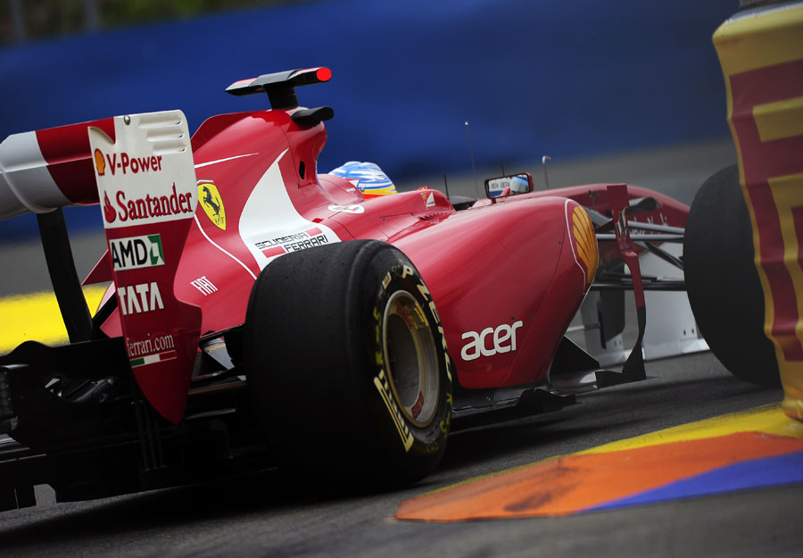 Fernando Alonso gets close to the barriers in his Ferrari