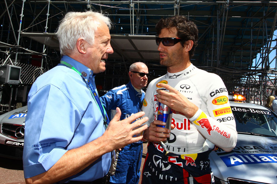 Charlie Whiting talks to Mark Webber before the race