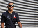 Lewis Hamilton arrives in the paddock on Saturday morning