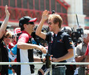 Sebastian Vettel waves to the crowd on the drivers' parade