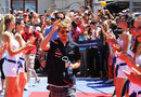 Sebastian Vettel enjoys the attention of the grid girls