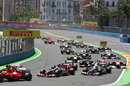 Lewis Hamilton and Jenson Button follow the Ferraris into turn two