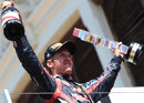 Sebastian Vettel celebrates his victory on the podium