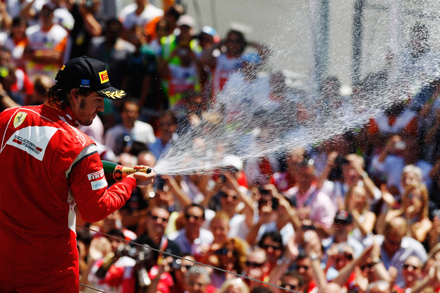 Fernando Alonso celebrates his second place in front of his home fans