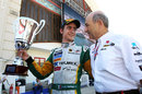 Esteban Gutierrez celebrates his sprint race victory with Peter Sauber
