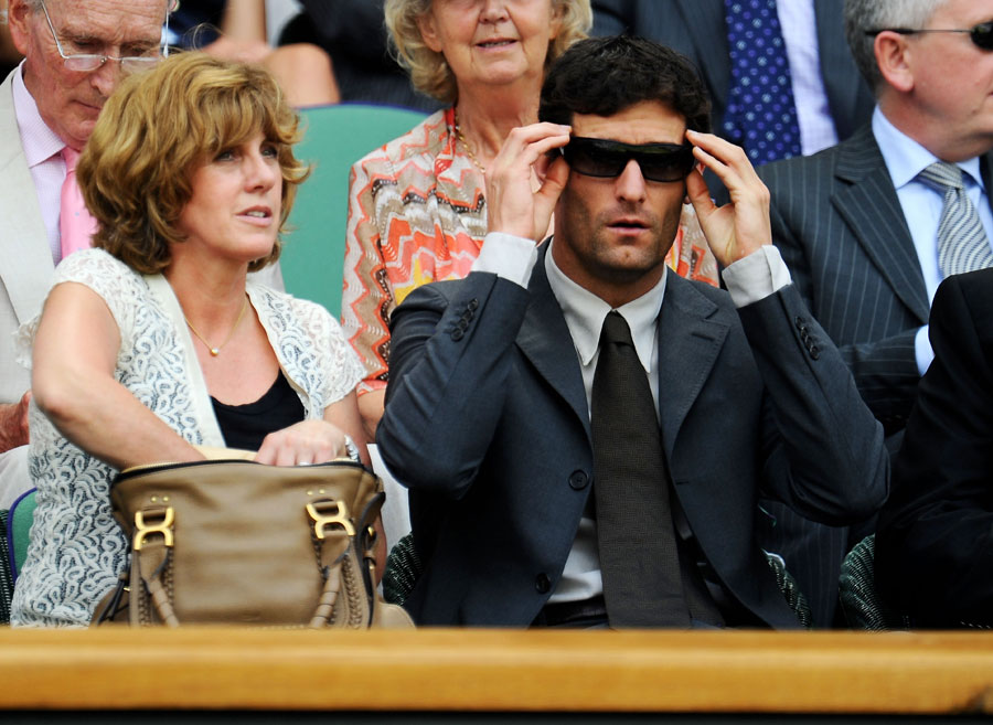 Mark Webber takes in the action at Wimbledon on Monday