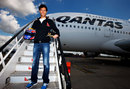 Mark Webber poses for a photo on the steps of an Airbus A380 after an announcement that he will train to become a pilot with the help of Qantas