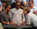 Lewis Hamilton and brother Nic meet Andy Murray's mother Judy on Centre Court at Wimbledon