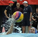 Jenson Button chats to the coach of the Hungarian national waterpolo team
