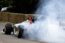 Bruno Senna lights up his tyres for spectators on the hill at Goodwood