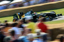 Karun Chandhok takes the Lotus T127 up the hill at Goodwood