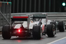 Lewis Hamilton follows Michael Schumacher down the pit lane