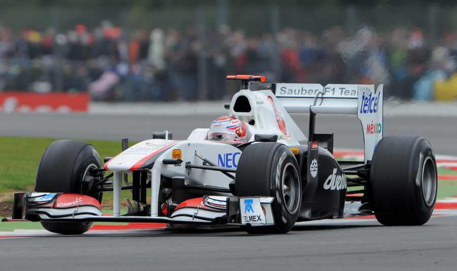 Kamui Kobayashi hurtles through a qualifying lap