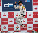 Roman Grosjean celebrates on the podium on the podium at Silverstone