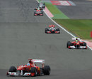 Race winner Fernando Alonso leads team-mate Felipe Massa