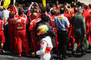 Lewis Hamilton walks back past the Ferrari celebrations 