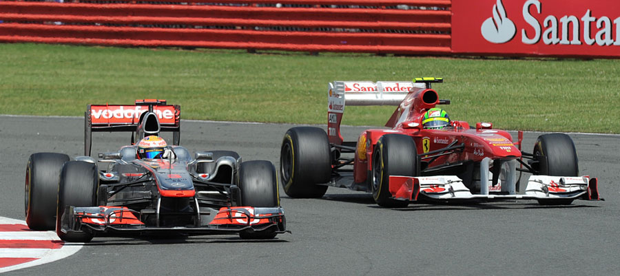 Lewis Hamilton battles off Felipe Mass on the final corner