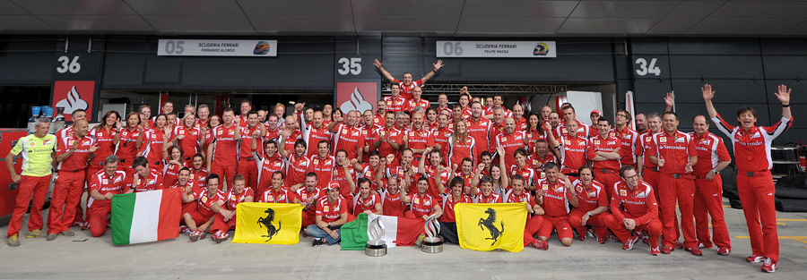 Fernando Alonso and his team celebrate their first win of the season