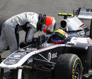 Rubens Barrichello talks to Williams team-mate Pastor Maldonado after the race