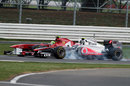 Jenson Button locks up as he passes Felipe Massa