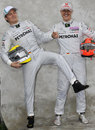 Nico Rosberg and Michael Schumacher share a joke with photographers 