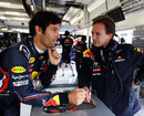 Mark Webber and Christian Horner talk in the Red Bull garage
