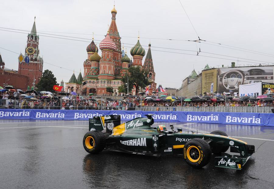 Karun Chandhok drives past St. Basils cathedral during the 'Moscow City Racing' show