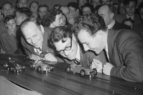 Reg Parnell, Bob Gerard and Stirling Moss at a slot car race
