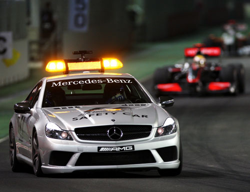 Lewis Hamilton held onto his lead behind the safety car