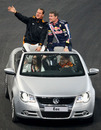Michael Schumacher and David Coulthard wave to the crowd at the Race of Champions