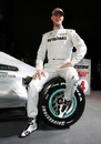 Michael Schumacher poses with the new Mercedes F1 car