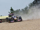 Sebastien Buemi's Toro Rosso lands in the gravel after launching over a kerb