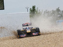 Sebastien Buemi's Toro Rosso splashes down in the gravel after spinning off the track