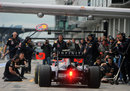 Mark Webber pulls in for some Red Bull pit stop practise