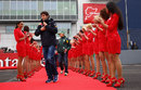 Mark Webber covers up against the cold ahead of the driver's parade