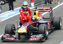 Mark Webber gives Fernando Alonso a lift back to the pits