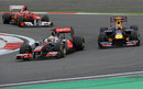 Lewis Hamilton holds off Mark Webber in turn one
