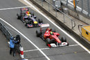 Felipe Massa leads Sebastian Vettel in for the final pit stops on the last lap