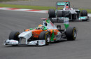Adrian Sutil leads Michael Schumacher on track