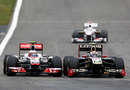 Jenson Button goes wheel-to-wheel with Vitaly Petrov