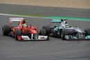 Felipe Massa outbrakes Nico Rosberg in to turn one