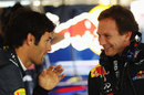 Mark Webber and Christian Horner share a joke in the Red Bull garage