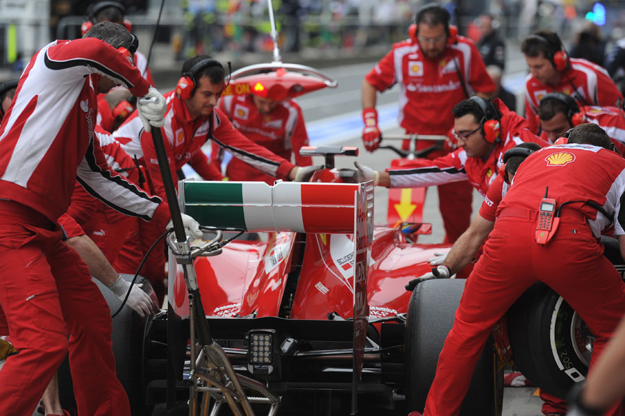 Ferrari mechanics practise a pit stop