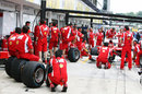 Ferrari practise pit stops during a break in the rain