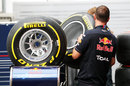 Red Bull mechanics work on their allocation of soft Pirelli tyres