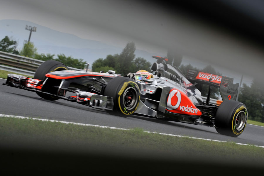 Lewis Hamilton attacks the circuit in his McLaren