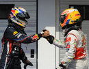 Lewis Hamilton congratulates Sebastian Vettel on taking pole position