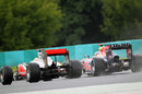 Lewis Hamilton storms up the inside of Sebastian Vettel for the lead