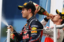 Sebastian Vettel sprays champagne on the podium after coming second
